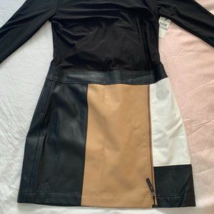 EUC Fully-lined long sleeve dress with faux leather trim and accents.